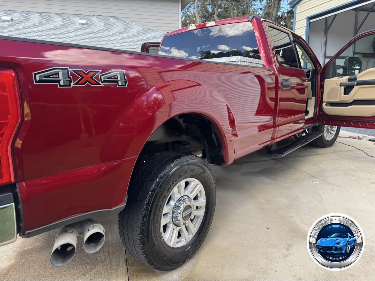 F-250 Super Duty exterior after a full detail — glossy paint, clean wheels and dressed tires