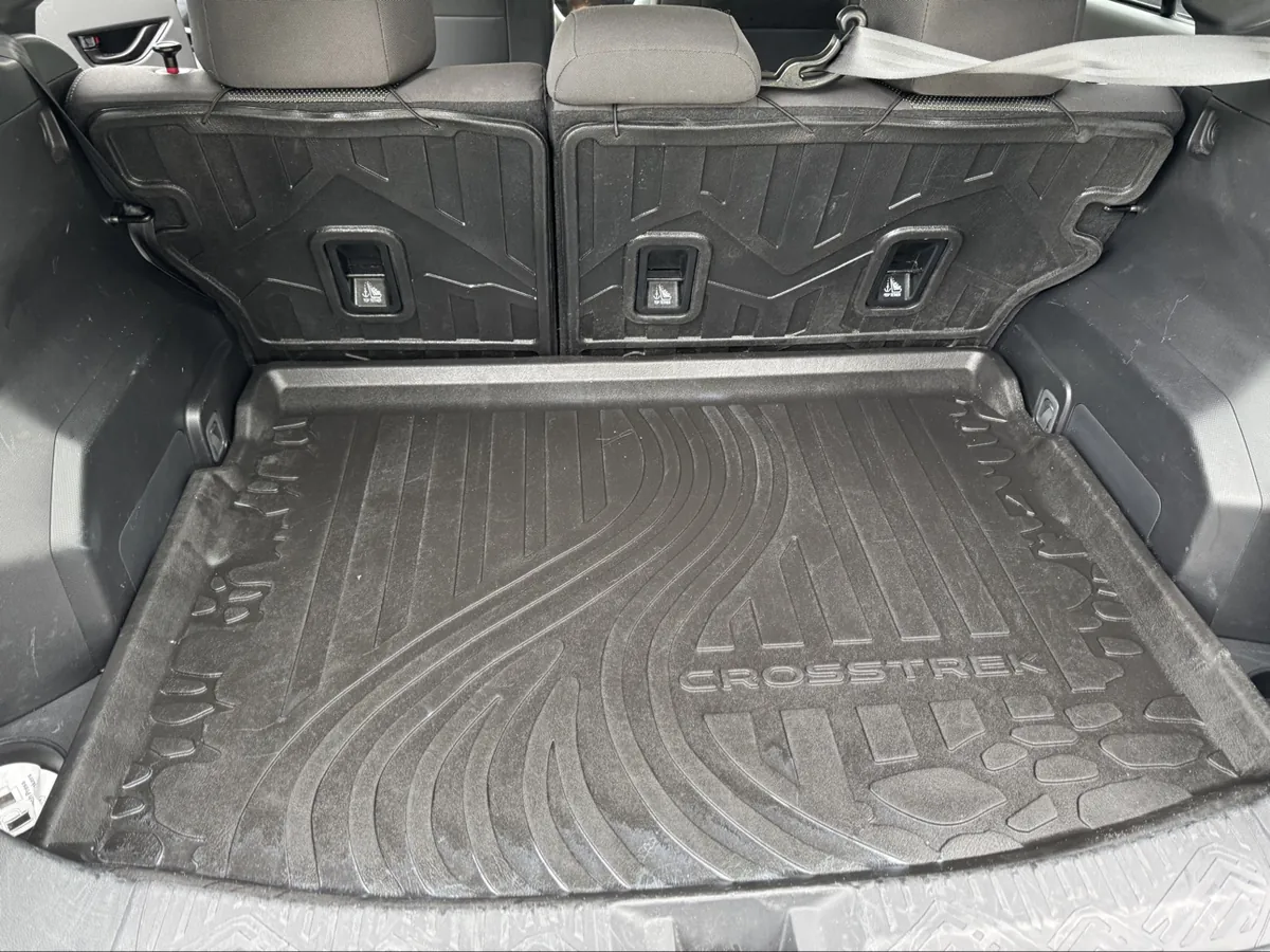 Finished Subaru Crosstrek cargo area after detailing — clean cargo tray and seatbacks