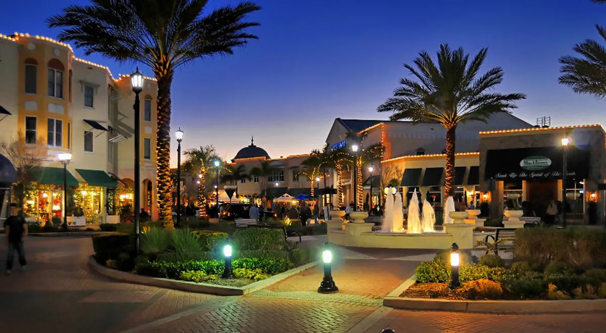 Lakewood Ranch Main Street at dusk with fountain and palm trees